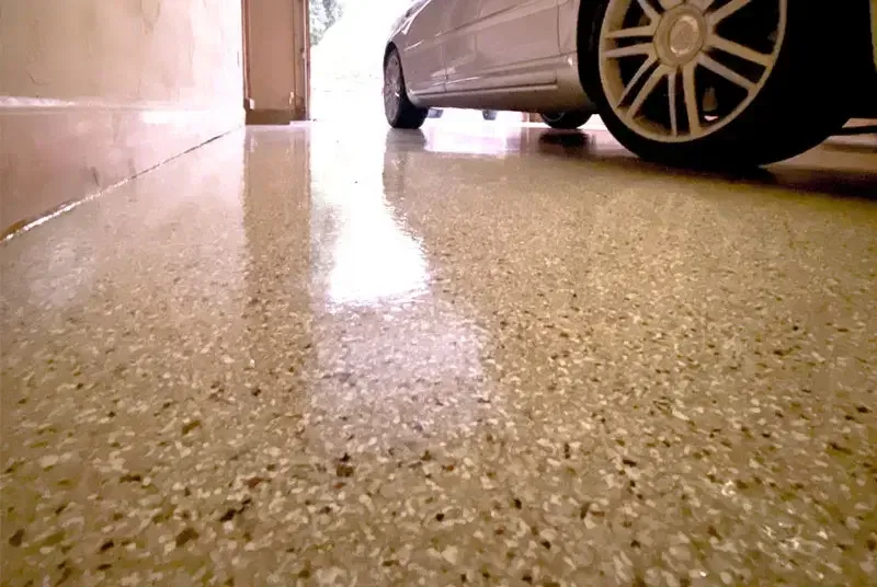 Flake garage floor coating in a residential garage